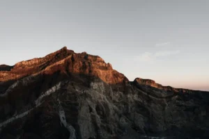 From Clement Duf, Unsplash. Top of the mount, success